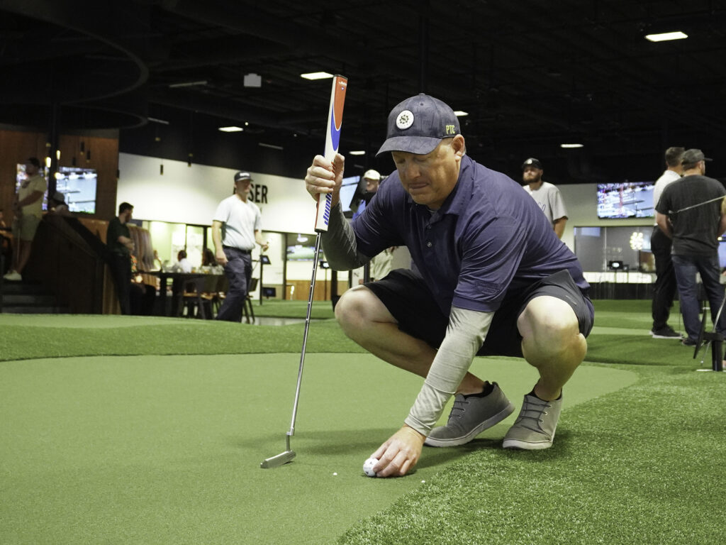 establish a pre-shot routine when putting and lining up putts to improve short games